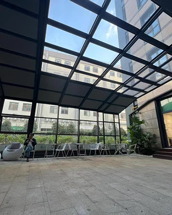 Curved Glass Sunroom With Retractable Roof